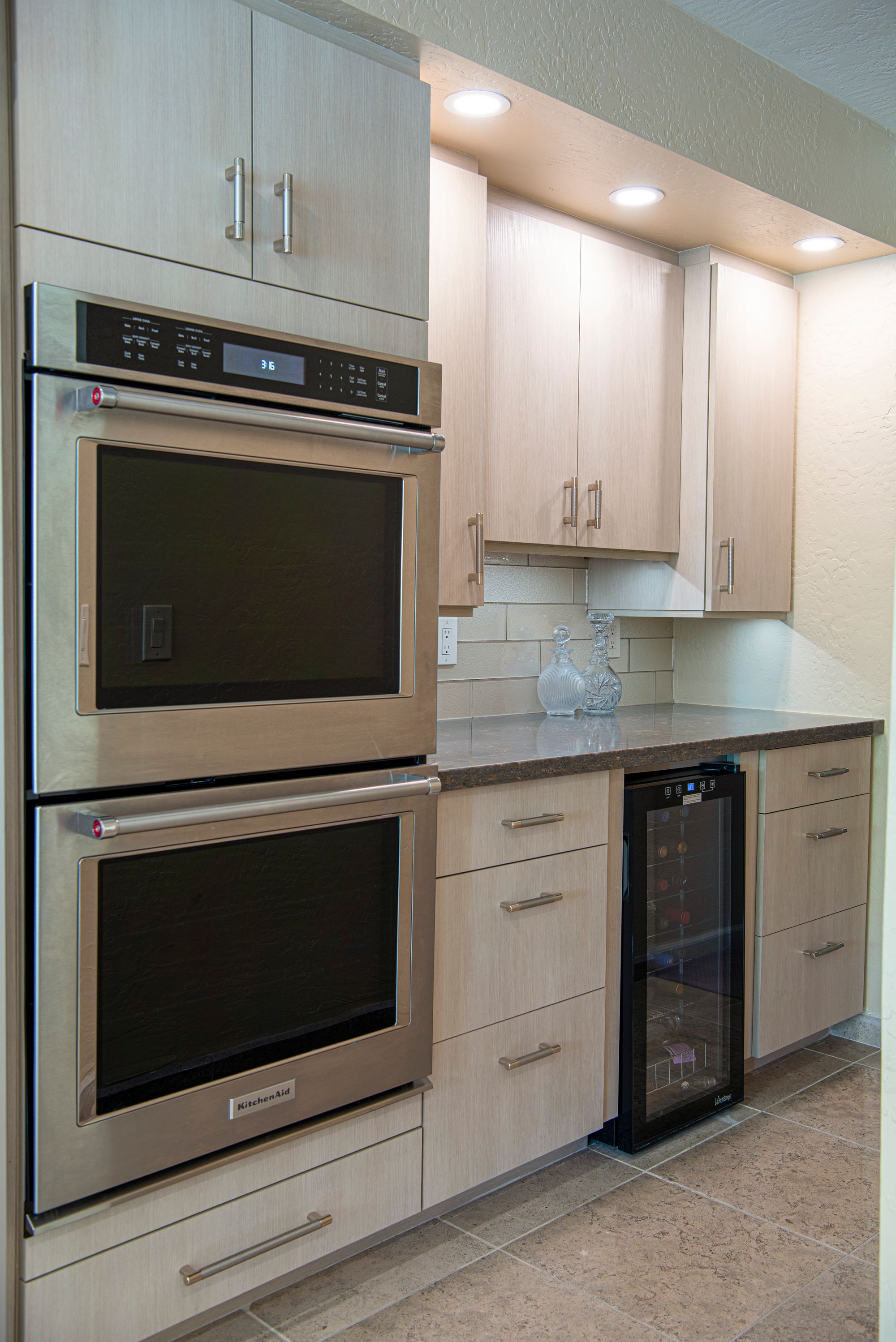 Integrated wall ovens and appliances in a finished kitchen